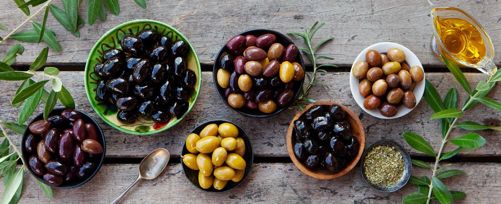 Variety of Australian olives in traditional bowls